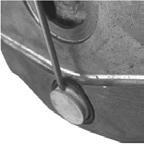 NOTICE: Damage can occur at the inner seal when the plug removal tool is improperly positioned between brake caliper and outer edge of the adjuster boot.