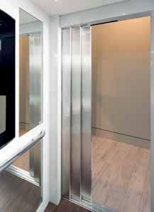 Sliding hall door panels are available in primered steel, brushed stainless steel or glass framed with stainless steel.