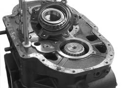 Using a chain hoist, lower the main case onto the clutch housing.