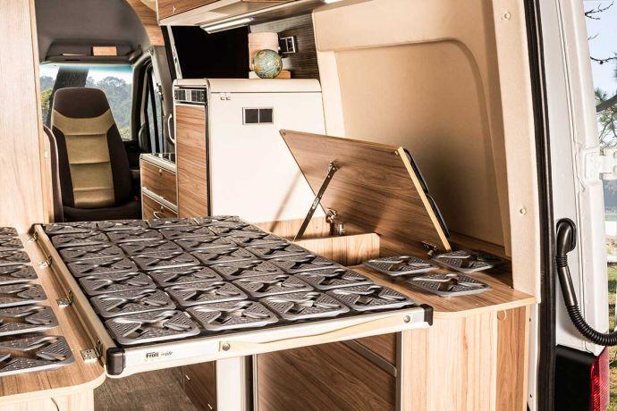 place while the vehicle is in motion. The storage space under the bed is easily accessible.