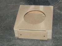 Leave an access opening in the front of the box and build a gasketed cover plate.