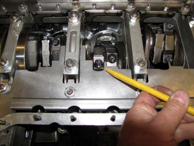 Rotate the engine, and check for clearance to the con rod ends and the crank counterweights. CLEARANCE SPECIFICATION Between.015 and.