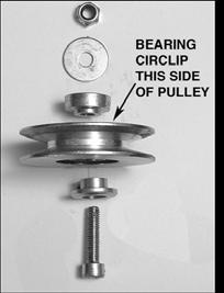 FIXED IDLER PULLEY ASSEMBLY 6. Remove the fastening nut from the bottom of the idler pulley stud and withdraw the stud.