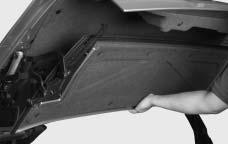 Move the rear tonneau rearward and up to the stored position. Pull from the center of the tonneau to keep pressure even.