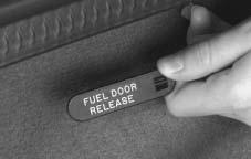The fuel door release button is located on the left side of the instrument panel. The button only works when the vehicle is in PARK (P) or NEUTRAL (N) and the valet lockout button is in OFF.