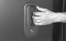 To close the sliding side door from outside, use the outside door handle to slide the door