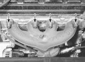 6 Undo the retaining nuts securing the manifold to the head (see illustration). Manoeuvre the manifold out of the engine compartment, and discard the manifold gaskets.