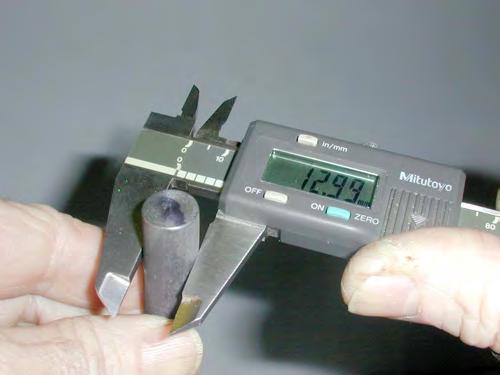 Use your right thumb to slide the blades to contact the specimen. NOTE: This is a precision instrument, not a C-clamp.