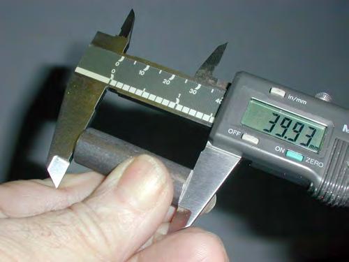 Measure the gage length 3 times and average. Figure 5. Measure the gage diameter and gage length three times each.