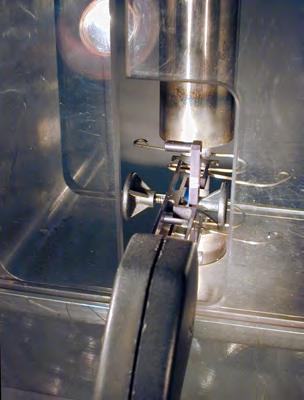 Carefully slide the plastic shields to enclose the rear of the fixture (Figure 15). Leave a clearance of a few millimeters. DO NOT CONTACT THE EXTENSOMETER WITH A SHIELD.