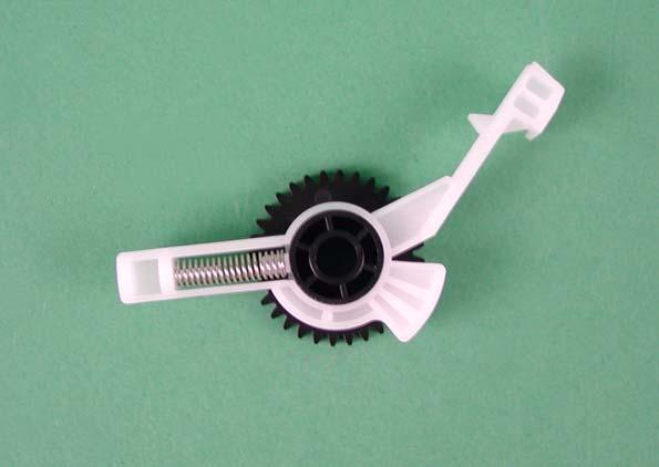 Remove "Spur Gear, 25.6" from "Lever, Change". 8. Remove "Compression Spring, 2.36" from the dowel of "Lever, Change". Spur Gear, 27.2 Silicon Material Part Compression Spring, 2.