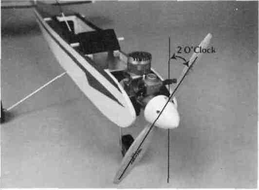 engine on the engine mount so that the propeller clears the front of the fuselage and the center line of the engine is in line with the center