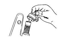 3. Use a small screwdriver to push down on one side of the piston retaining ring to force the ring out of the groove. Figure 9. 4. Extend the coils of the ring. 5.
