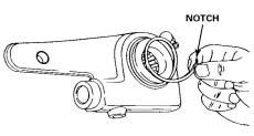 10. If necessary, install a new bushing onto the clevis pin. Use the clevis pin and mallet to drive out the old bushing while you drive in the new bushing.