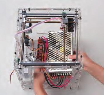 Pass the rightmost of the two thick pink power cables from the driver board through the