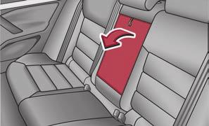 Before folding the seat backrest back into the secure position, place the rear lateral seat belt behind the edge of the side trim panel.
