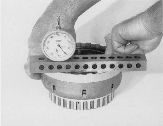 Extend dial gauge pointer until it touches the end disc, and set dial gauge to O.