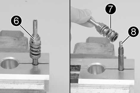 20) Release hydrostop needle1and remove it from the piston rod. The valve2usually remains in the hydrostop needle.