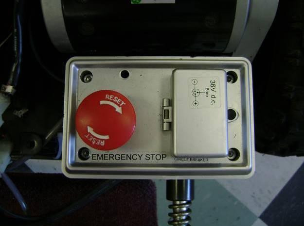Figure 111: Emergency stop button. Figure 112: 36 volt circuit breaker and charging port.