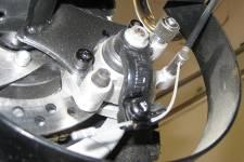 vehicle, and a brake cable that is responsible for the operation of the caliper. Figure 93 below shows the disc brakes at the rear of the go-kart. Figure 93: Rear disc brakes.