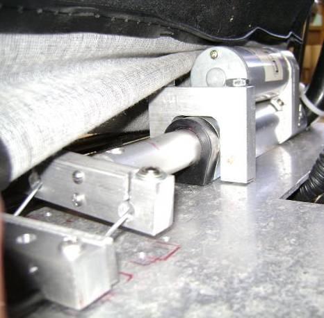 brackets, and the cables. Holes were drilled in the frame of the go-kart to attach the plate to. The plate (with the actuator on it) is shown in Fig. 95 below.