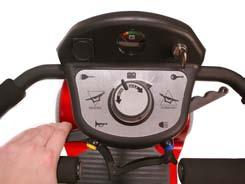 To move the scooter in a REVERSE motion PULL the lever with the LEFT HAND or PUSH the lever with the RIGHT THUMB.