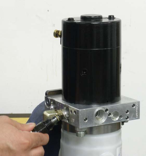 FIGURE 3-64 Re-install Cross-over relief valve.