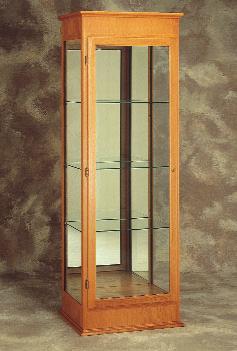 694 Oak framed case with 3 full-length adjustable shelves and sliding doors.