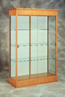 792 Oak framed case with 3 full-length adjustable shelves and hinged door.