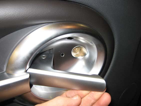 behind door handle. A plastic spoon can be used.