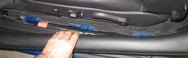 Push in and pull out the two ends of the rubber grommet between door frame and vehicle frame.