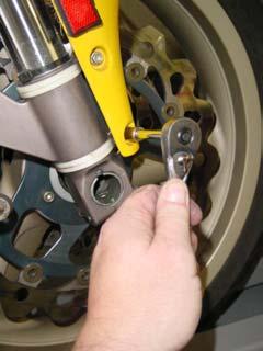 2. Using an 8mm socket, remove the 4 bolts that hold the front fender.