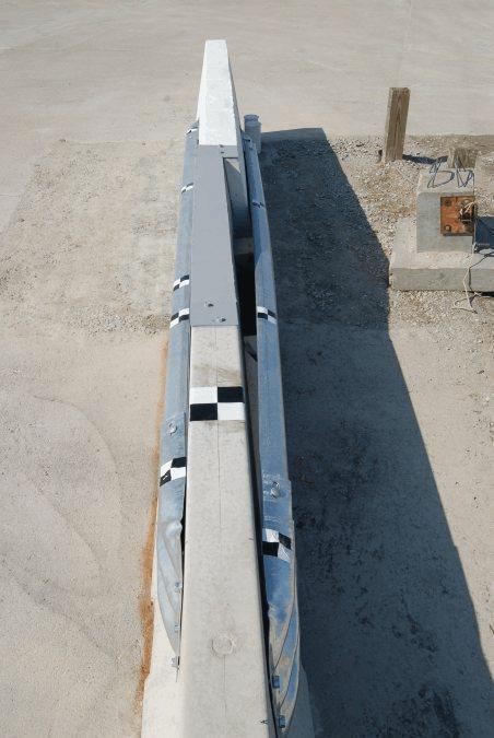 2.3 Transition from Pinned PCB to Rigid Concrete Barrier (TTI) The Texas A&M Transportation Institute (TTI) developed a transition from the pinneddown F-shape temporary concrete barrier to a