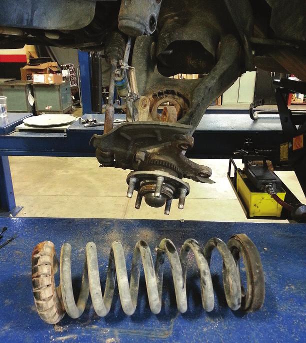 Remove coil spring (fig. 12). fig.
