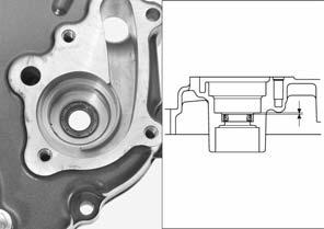 Install the oil seal to the right crankcase cover as shown. 0 0.5 mm (0 0.