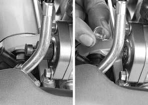 Install and tighten the cam chain tensioner lifter mounting bolts. Remove the tensioner stopper from the cam chain tensioner lifter.