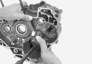 BEARING Remove the following: Crankshaft (page 14-6) Balancer shaft (page 14-14) Transmission (page 14-10) RIGHT CRANKCASE SIDE Remove the bolts and mainshaft bearing setting plate.