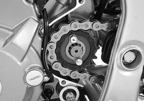 ENGINE REMOVAL/INSTALLATION Loosen the rear axle nut, lock nuts and drive chain adjusters. Push the rear wheel forward and make the drive chain slack fully.