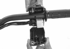 If the left handlebar grip was removed, apply Honda Bond A or equivalent to the inside surface of the grip and to the clean surface of