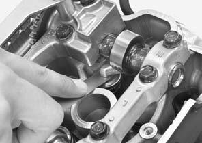 Check the valve clearance by inserting a feeler gauge between the rocker arm and shim. VALVE CLEARANCE: IN: 0.16 ± 0.03 mm (0.006 ± 0.001 in) EX: 0.27 ± 0.03 mm (0.011 ± 0.