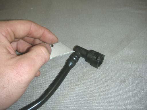 89. Take the rear EVAP hose from the stock manifold and carefully cut out