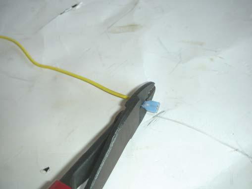 117. With the relay mounted, take the yellow trigger wire from the relay, strip