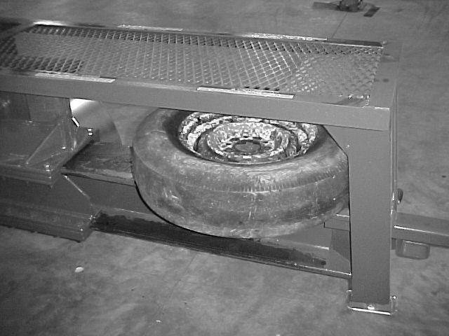 5 Place tire & wheel into the TC-300 crushing chamber.