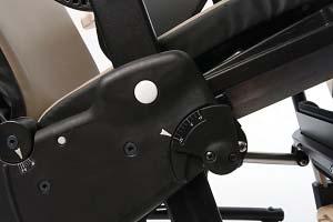 To adjust tilt-in-space angle, place one hand on push handle or top of backrest and use the other hand to squeeze tilt lever and safety lock (see Figure 13b).