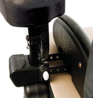Place the left hip guide over the arm support slot with the white button for lateral adjustments on the outside of the chair facing the backrest (see Figure 30a).