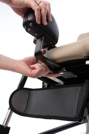 To adjust depth of abductor to seat, press white abductor button and pull abductor to desired setting then release button making sure abductor audibly locks into place.