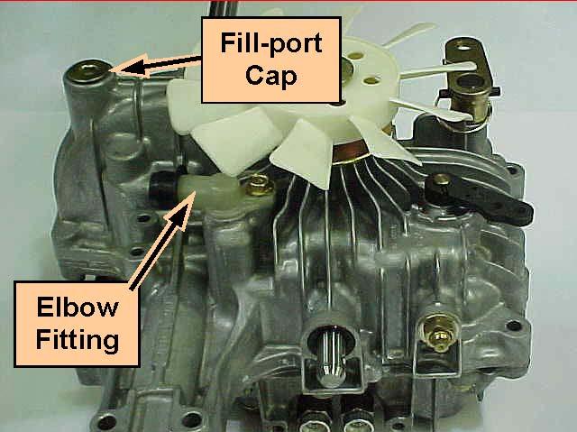 Flip transmission upright and remove the fill port cap of gear-room and