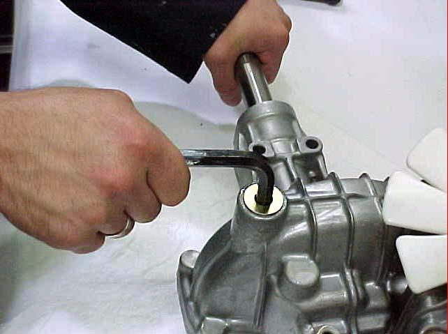 44. Install cap in gear room oil port with 10 mm hex wrench.