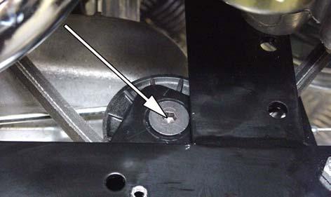 Remove the nut for the tension pulley. Activate the parking brake and take off the drive belt from the tension pulley.