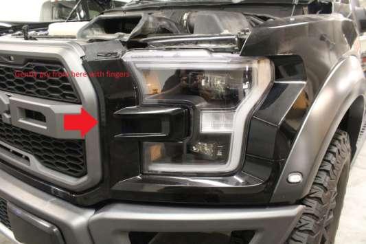 5. Gently pry on headlight surrounds by